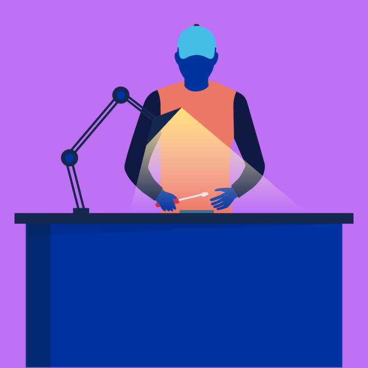 Telefonen bliver repareret af en tekniker p&aring; et reparationscenter